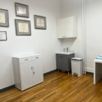 bright medical office with desk and chairs