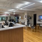 large medical lobby with front desk, chairs and brochures